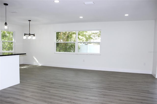 unfurnished living room featuring dark hardwood / wood-style floors