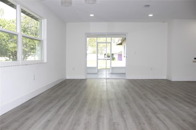 empty room with light hardwood / wood-style floors