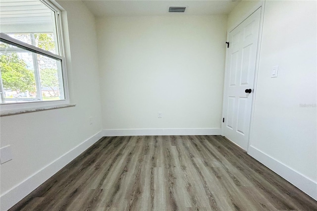 spare room with hardwood / wood-style flooring