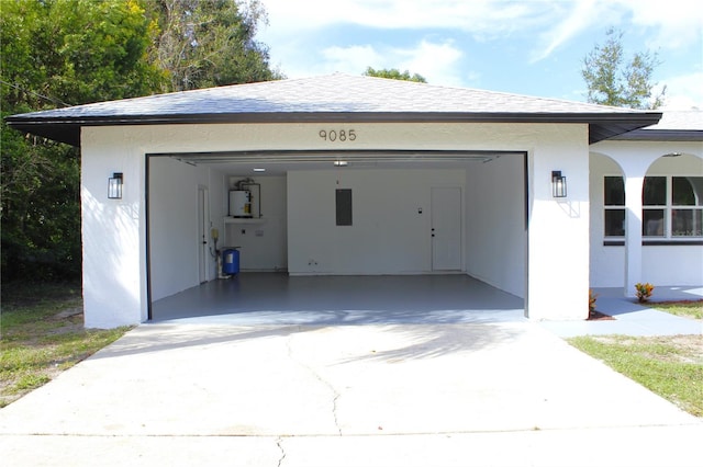 9085 Dorsey St, Spring Hill, FL 34608 - garage with driveway and gas water heater