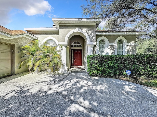 doorway to property featuring a garage