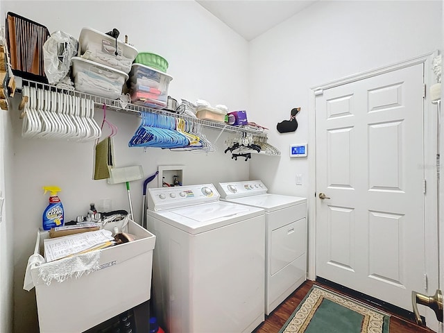 washroom with dark hardwood / wood-style floors and independent washer and dryer