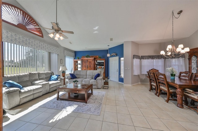 tiled living room featuring ceiling fan with notable chandelier