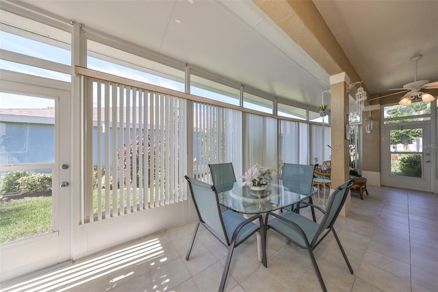 unfurnished sunroom with a healthy amount of sunlight and ceiling fan