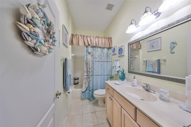 full bathroom with vanity, tile patterned floors, toilet, and shower / bath combo