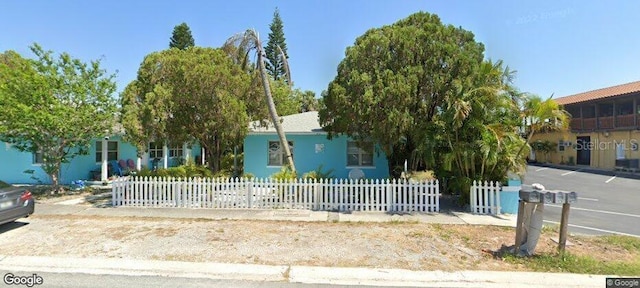 view of property hidden behind natural elements