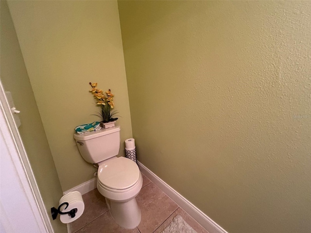 bathroom featuring tile patterned floors and toilet