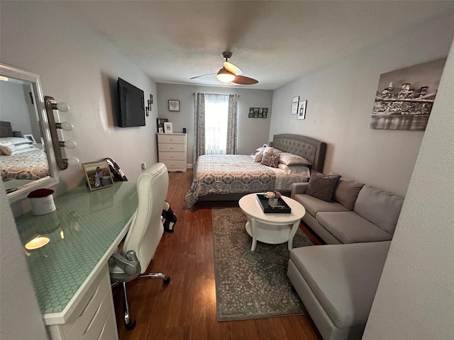 bedroom featuring ceiling fan, dark wood-type flooring, and a textured ceiling