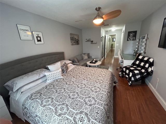 bedroom featuring dark wood-type flooring and ceiling fan