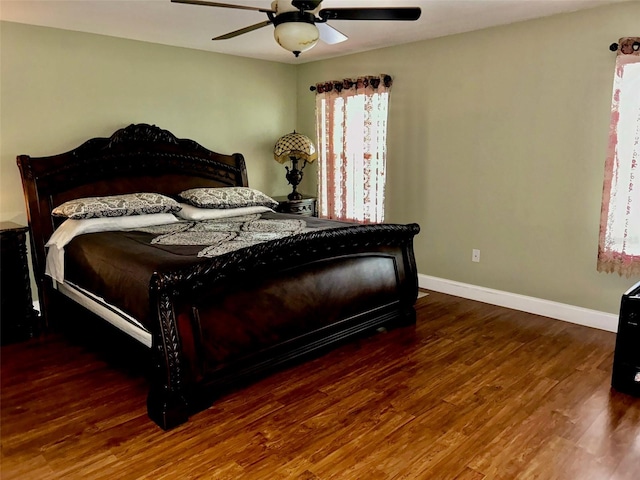 bedroom featuring ceiling fan and dark hardwood / wood-style floors