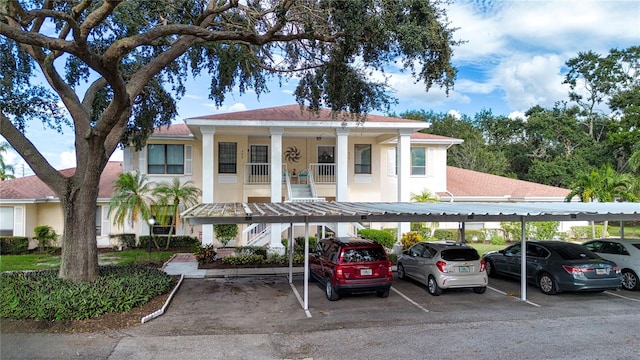 view of front of property featuring a carport