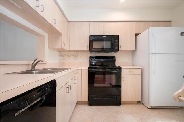 kitchen featuring light tile patterned floors, light brown cabinets, sink, and black appliances