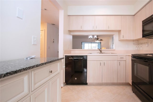 kitchen with light tile patterned floors, a notable chandelier, sink, and black appliances