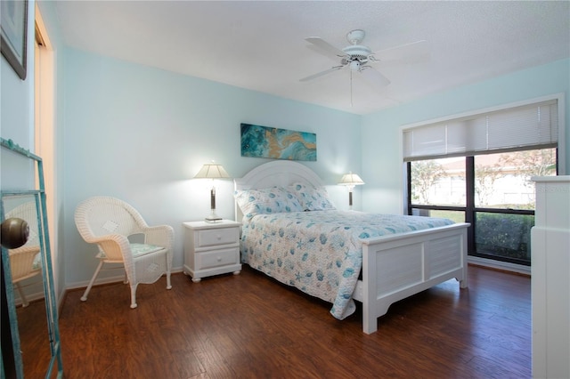 bedroom featuring ceiling fan and dark hardwood / wood-style flooring