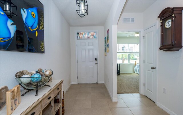 1523 Glen Grove Loop, Wesley Chapel, FL 33543 - foyer entrance with ceiling fan, baseboards, and light tile patterned flooring