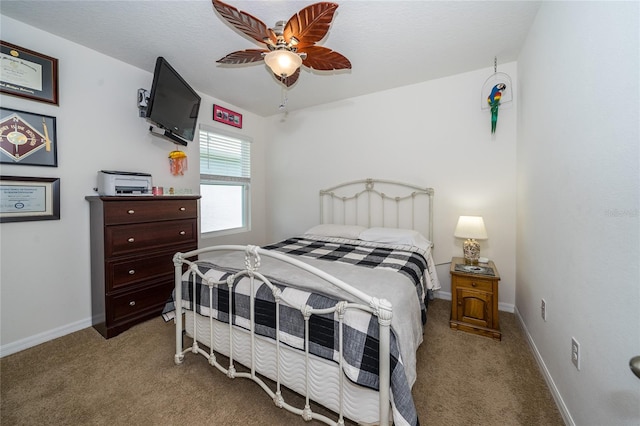 bedroom featuring carpet floors, ceiling fan, and baseboards