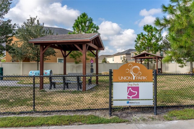 view of home's community with a yard, fence, and a gazebo