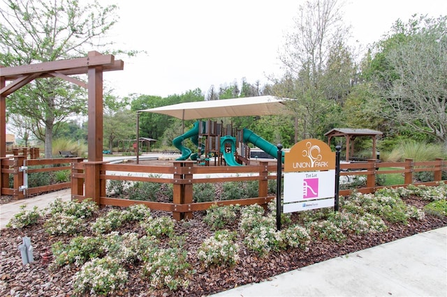 communal playground featuring fence