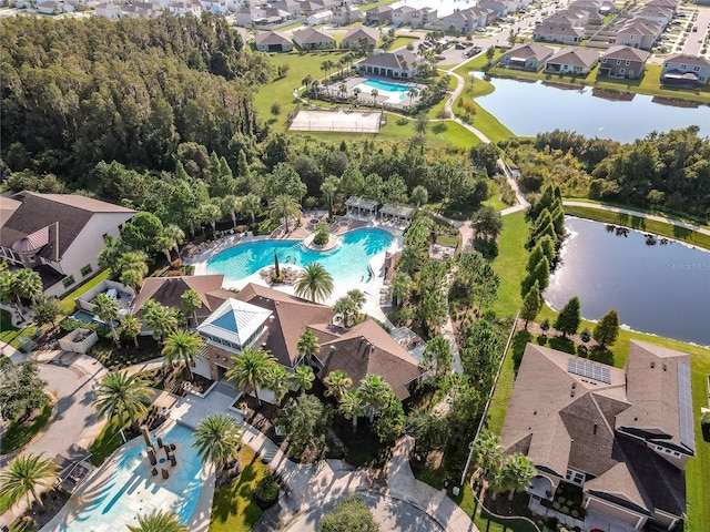 1523 Glen Grove Loop, Wesley Chapel, FL 33543 - aerial view of property and surrounding area featuring a pool, a nearby body of water, and nearby suburban area