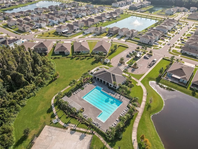 bird's eye view with a residential view and a water view