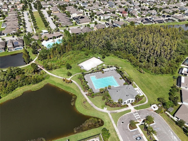 1523 Glen Grove Loop, Wesley Chapel, FL 33543 - aerial view of property and surrounding area featuring a pool area, nearby suburban area, and a nearby body of water
