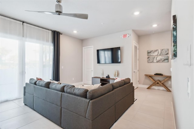 tiled living room featuring ceiling fan