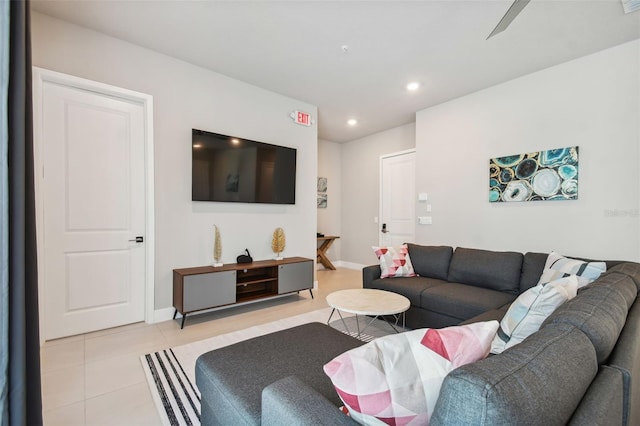 living room featuring ceiling fan and light tile patterned flooring