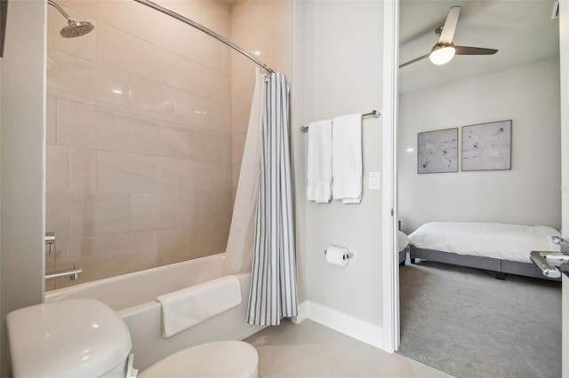 bathroom featuring shower / tub combo with curtain, ceiling fan, tile patterned floors, and toilet