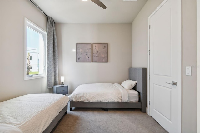 carpeted bedroom featuring ceiling fan