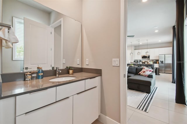 bathroom with tile patterned flooring and vanity