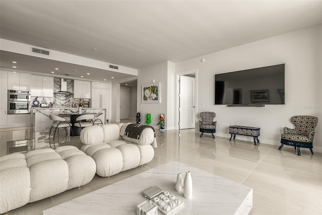 living room with light tile patterned floors