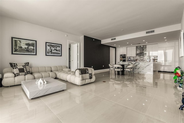 living room with light tile patterned floors