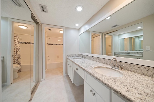 full bathroom with vanity, toilet, shower / bath combo with shower curtain, and a textured ceiling