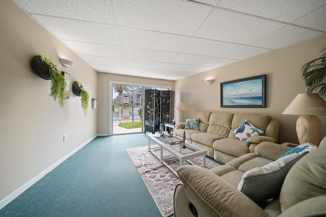 living room with carpet floors and a drop ceiling