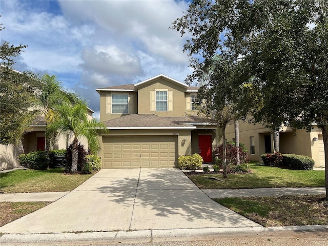 view of front of house featuring a front yard and a garage