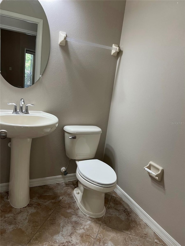 bathroom featuring toilet