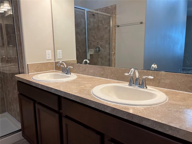 bathroom featuring walk in shower and vanity