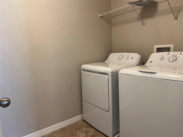 laundry area with washing machine and clothes dryer