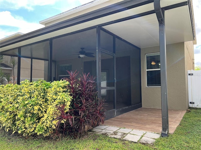 property entrance with ceiling fan