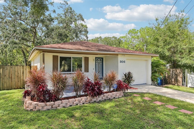 view of front facade with a front yard and a garage