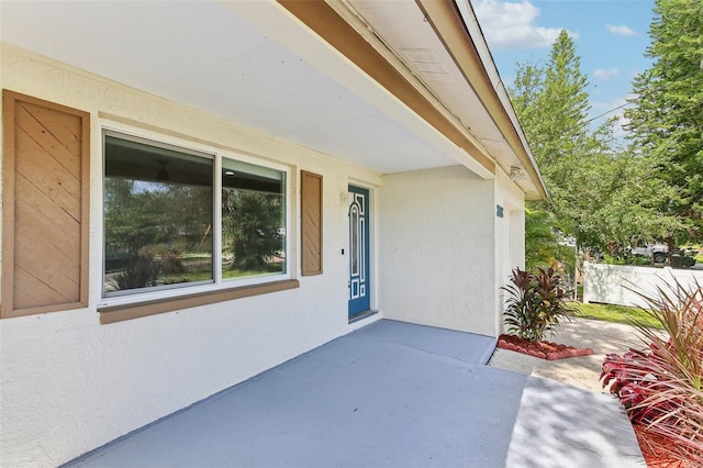 doorway to property featuring a patio area