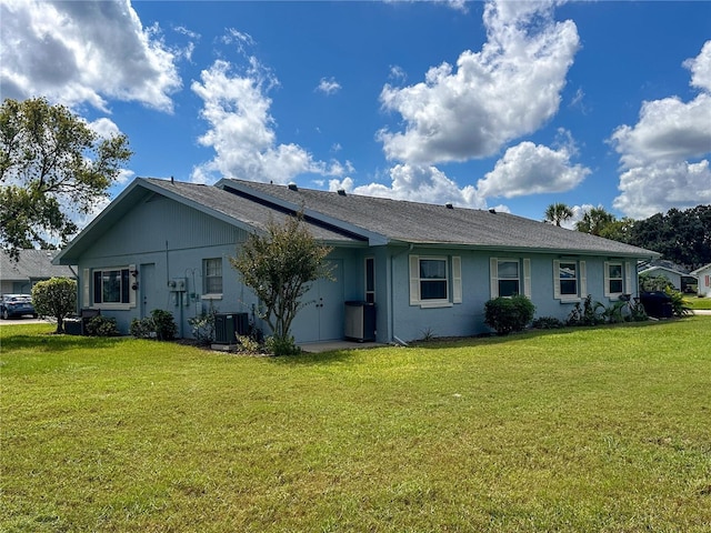 216 Gloucester Blvd Unit 216, Sun City Center, FL 33573 - view of front of property with stucco siding, cooling unit, and a front lawn