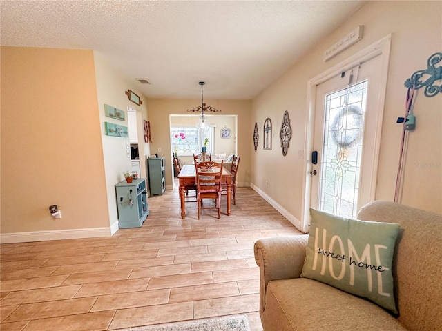 216 Gloucester Blvd Unit 216, Sun City Center, FL 33573 - dining room featuring light wood-style floors, baseboards, and a wealth of natural light