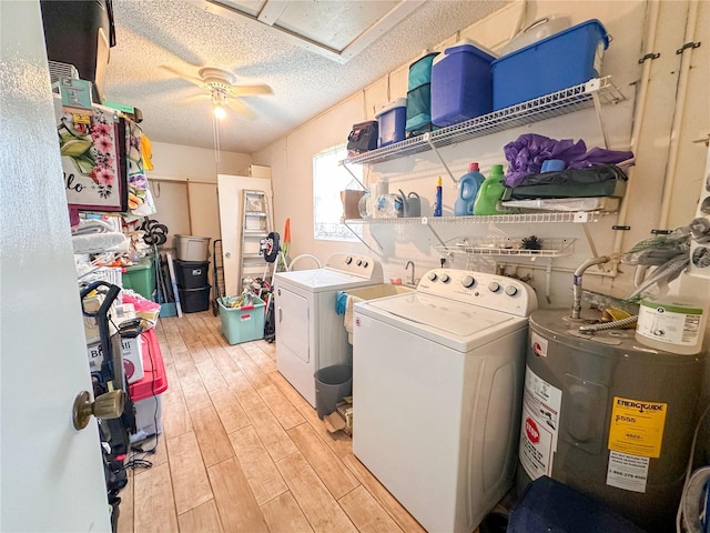 washroom with light hardwood / wood-style floors, separate washer and dryer, electric water heater, a textured ceiling, and ceiling fan