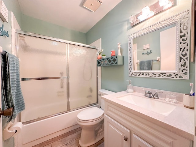 full bathroom with vanity, toilet, tile patterned floors, and bath / shower combo with glass door