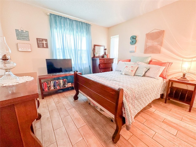 bedroom featuring hardwood / wood-style floors