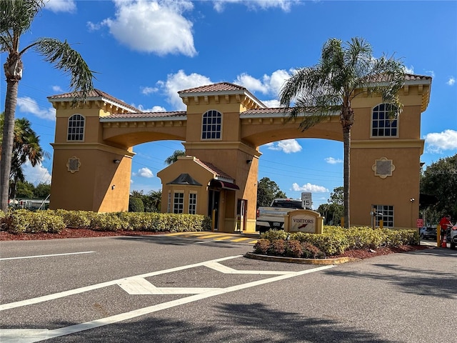 216 Gloucester Blvd Unit 216, Sun City Center, FL 33573 - view of property featuring uncovered parking