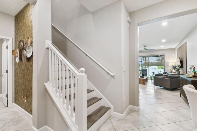 10012 Corso Milano Dr, Tampa, FL 33625 - stairway featuring tile patterned floors, ceiling fan, baseboards, and recessed lighting