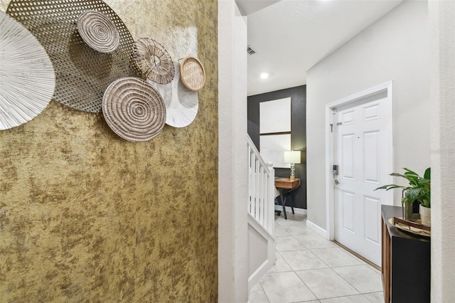 10012 Corso Milano Dr, Tampa, FL 33625 - hallway featuring baseboards, light tile patterned flooring, and stairway