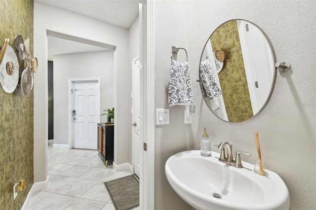 bathroom featuring tile patterned flooring and sink